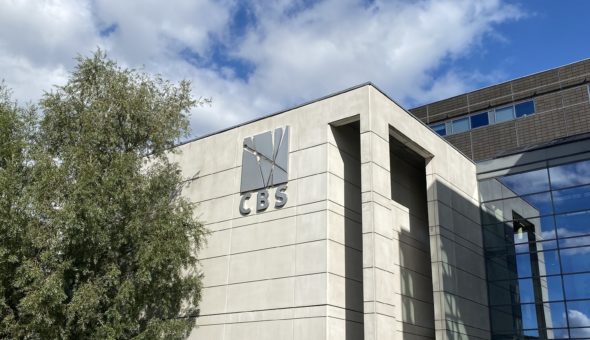 A CBS campus building with lots of bikes parked in front of it