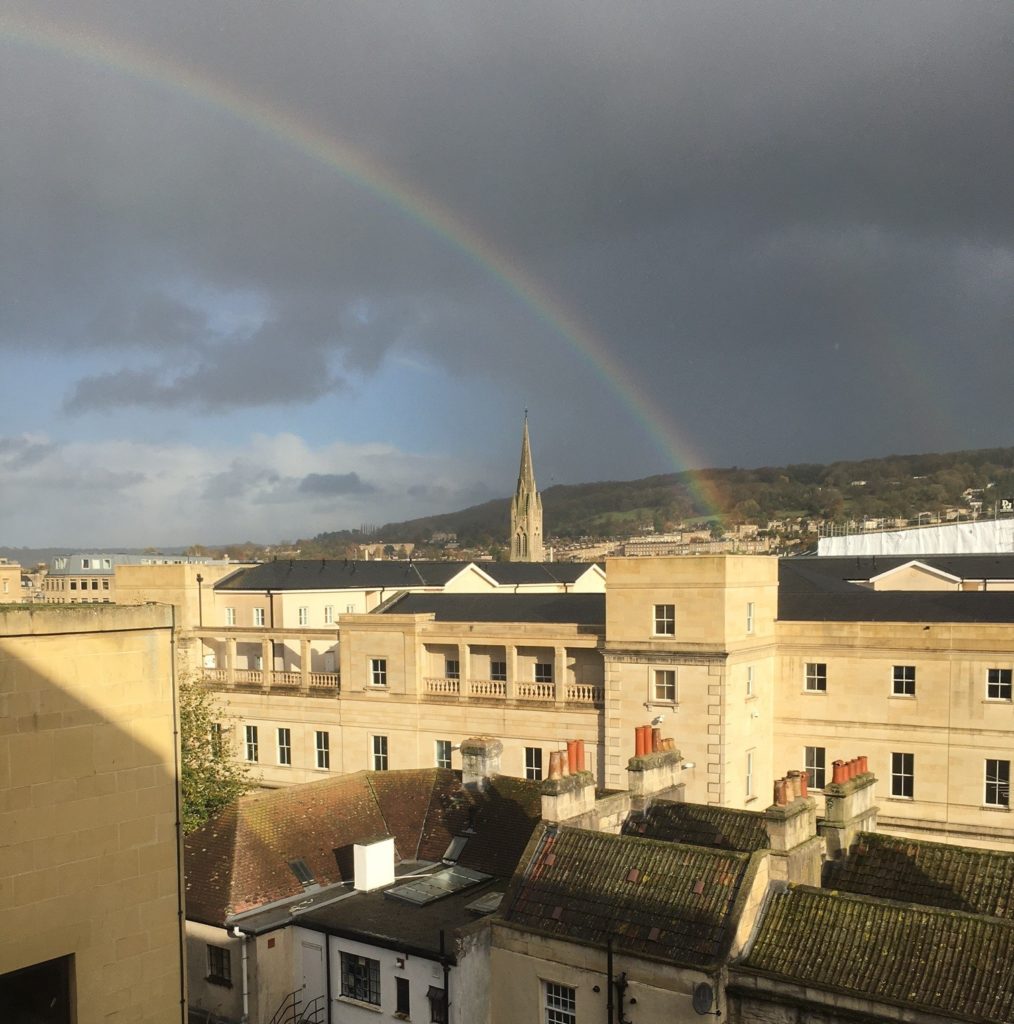 View of the citbuuildings with a rainbow.