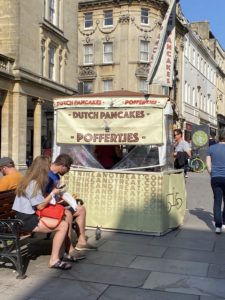 A cream-coloured stand with the words "Dutch Pancakes - Poffertjes"