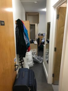 View of my accommodation room from the door on moving in day, so it's full of bags and mess.