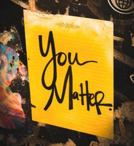 A bright yellow note pad which says You matter in black text