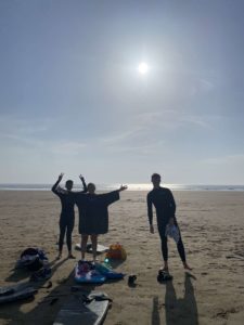 Friends standing on a beach