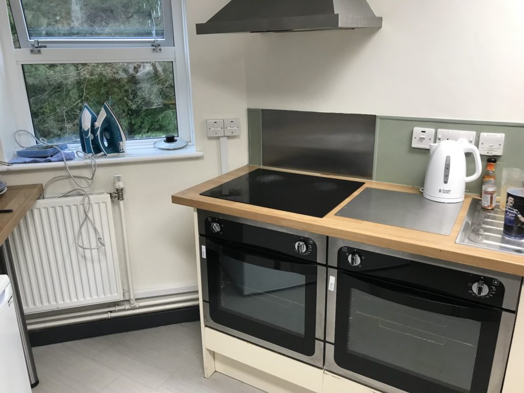 A corner of the kitchen in Brendon Court, which includes an electric hob, and two ovens below it