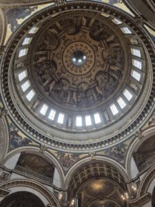 Upwards shot of the inside of the domed roof of St Pauls Cathedral.