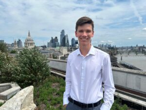 Photo of Ben with the London skyline behind him. 