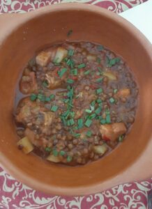 Top down view of a bowl of lentil stew (Guiso de Lentejas )