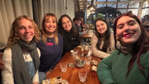 Selfie of a group of women at at a restaurant table (Nell and fellow English teachers)