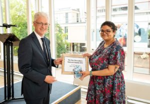 Nina receiving an award from the VC