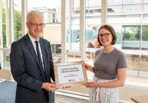 Rachel receiving an award from the VC