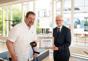 Richard receiving an award from the VC