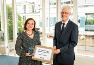 Sandra receiving an award from the VC