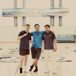 A picture of me, a summer school volunteer, and a summer school student after a martial arts class