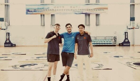 A picture of me, a summer school volunteer, and a summer school student after a martial arts class