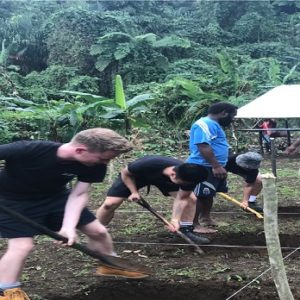 Students helping to dig foundations for the school