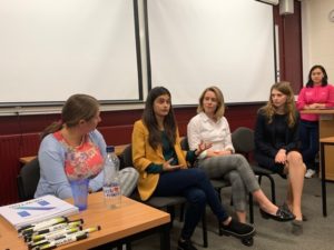 Photograph showing the panel guests taking questions from the audience. 